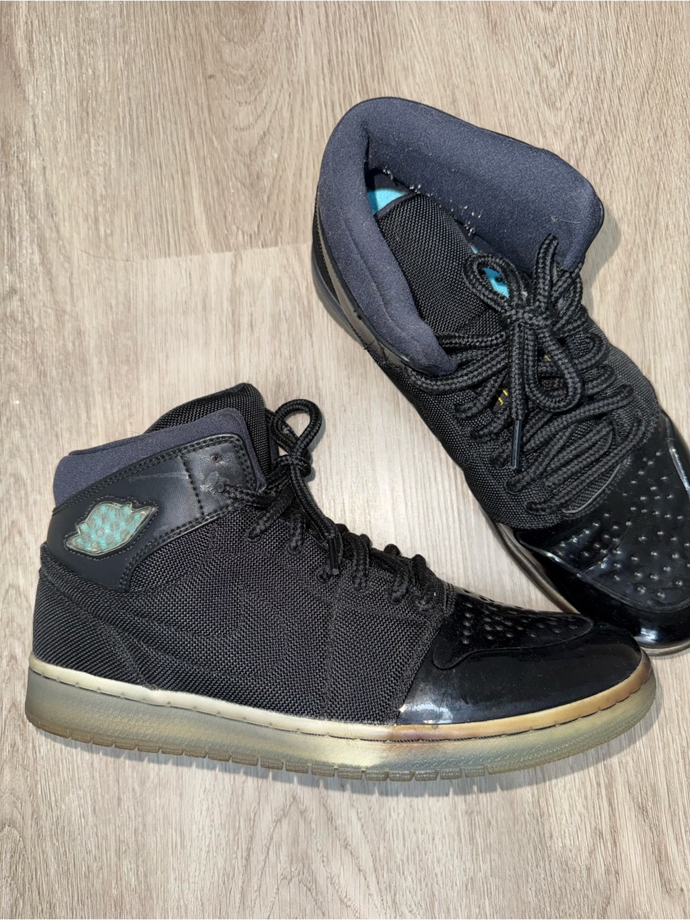 Jordan Men's Black High-Top Sneakers with Teal Accents